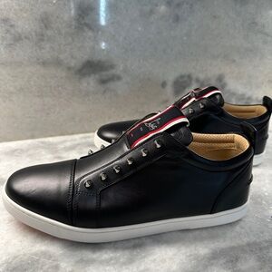 Black Leather calfskin Sneakers with original red bottom. Never worn.